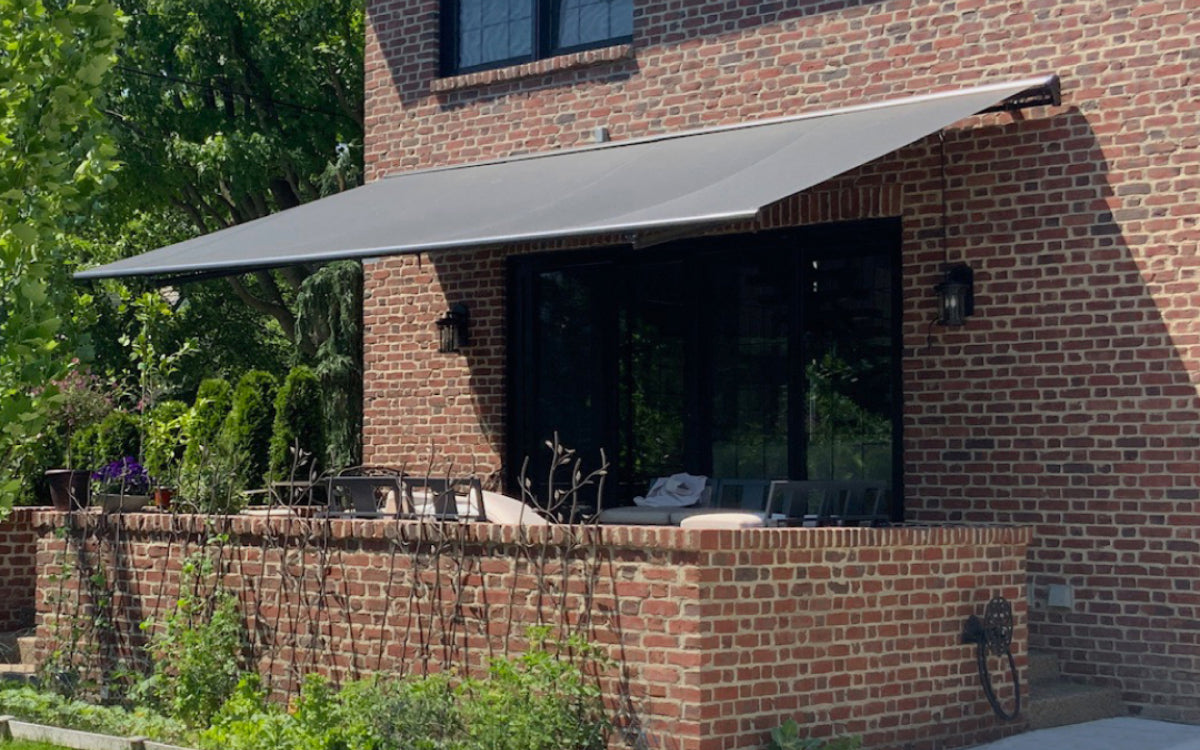 Retractable Awning on Brick House